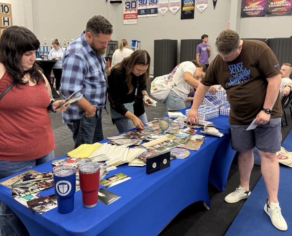 people looking through memorabilia