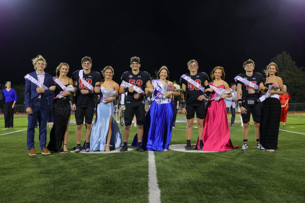 Image of 2025 homecoming court participants on the football field